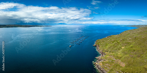 Aerial view of the landscape surrounding Diabaig, Lower Diabaig and Torridon village in the north west highlands of Scotland during summer on a blue sky day with light clouds