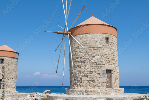 The medieval windmills in Mandraki harbour in Rhodes, Greece