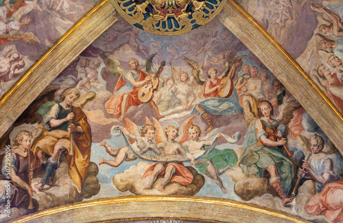 VALENCIA, SPAIN - FEBRUARY 15, 2022: The ceiling fresco of angels with the music instruments in presbytery of the church Iglesia del Patriarca by Bartolome Matarana (1550-1625).