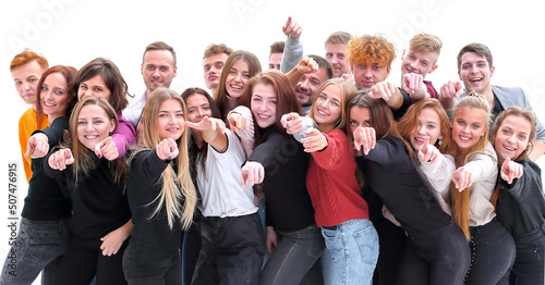 large group of casual young people pointing ahead
