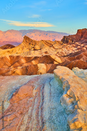 Death Valley waves of colors in mountains at sunrise