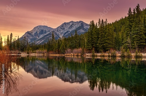 Reflections On The Mountain Lake At Sunrise