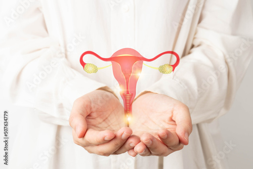 Healthy uterus and ovaries anatomy on doctor hands. Awareness of women health care such as endometriosis disease, PCOS, STDs, ovarian or cervical cancer screening. Gynecology and reproductive system.