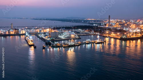 Aerial view oil terminal storage tank farm at night, Tank farm storage chemical petroleum petrochemical refinery product at oil terminal, Business commercial trade fuel and energy transport.