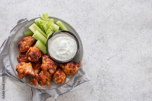 buffalo chicken wings with celery and ranch sauce