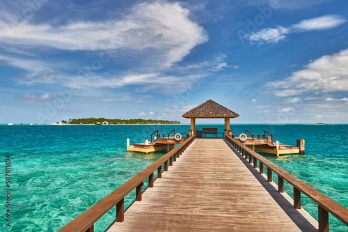 Maldives paradise scenery. Tropical aerial landscape, seascape with long jetty, water villas with amazing sea and lagoon beach, tropical nature. Exotic tourism destination banner, summer vacation