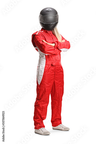 Female racer in a red suit and black helmet posing