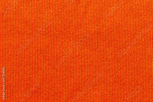 Orange color fabric cloth polyester texture and textile background.