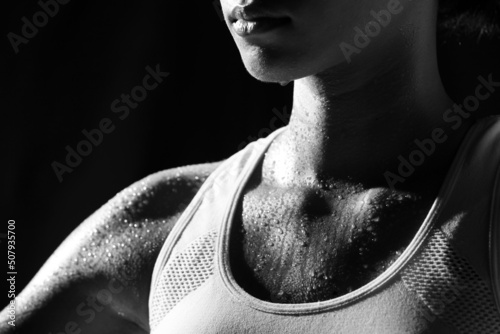 Asian Tan Skin Sport Girl in Fitness Bra, exercise sweat water drop in low key exposure lighting