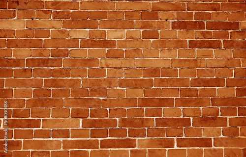 Brick wall surface in orange tone.