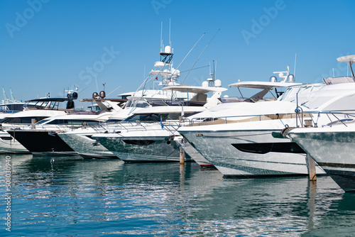 Sea reflecting sunlight at luxury motor yacht boats in South Beach, USA