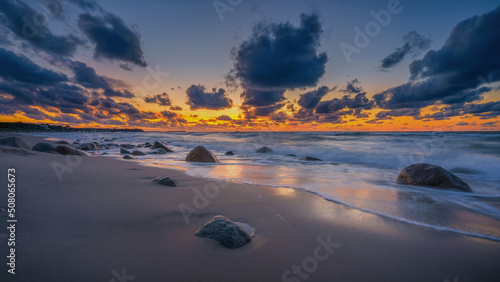 colorful sunset on the rocky seashore