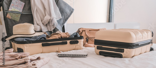 Travel. Staycation.local travel new normal.Girl packing luggage in suitcase and travel documents Travel,tourism,vacation,relocation.Mental health and travel vacation Film grain