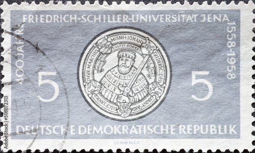 GERMANY, DDR - CIRCA 1958 : a postage stamp from GERMANY, DDR, showing the seal of the Friedrich Schiller University of Jena . 400 years Friedrich Schiller University Jena .Circa 1958