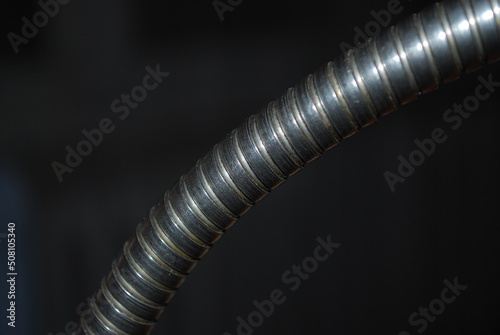 Old lamp headband, metal, spiral, on a dark background