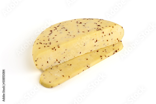Traditional Latvian homemade cheese with cumin seeds for annual Latvian festival celebrating the summer solstice Ligo holiday. Isolated on white background.