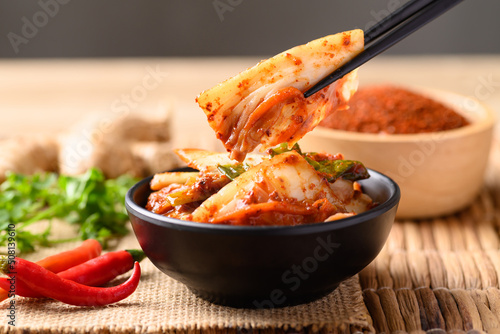 Kimchi cabbage eating by chopsticks, Korean homemade fermented side dish food