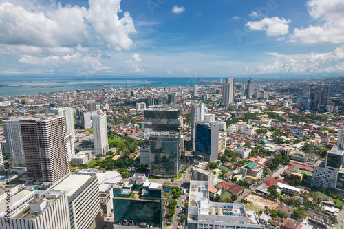 Cebu City, Philippines - The Cebu City skyline, from Cebu Business Park to uptown area. CCLEX bridge visible in aerial.