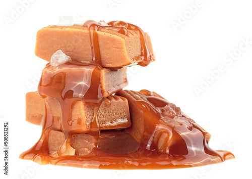 Caramel candies with melted caramel and sea salt isolated on a white background
