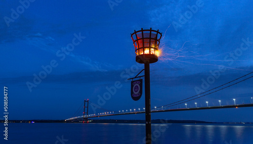 Humber Bridge with Hessle Foreshore beacon lit up for the Diamond Jubilee celebrations, June 2nd 2022.