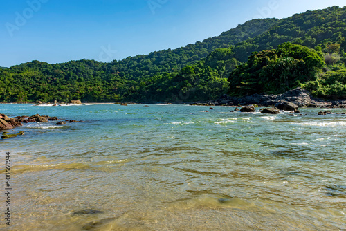 Paradise tropical beach with mountains and forests around in coastal Bertioga of Sao Paulo state, Brazil