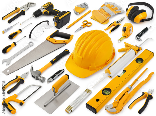 Construction work tools for building. Yellow hard hat with work equipment isolated on white background. Layout for home service repair concept or hardware store showcase banner.Top view set of objects