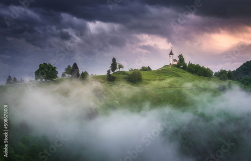 Jamnik church on top of the hill on a moody and stormy day after the rain.