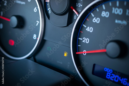 Fuel gauge gas empty. Car tank low petrol meter indicator on dashboard. Gas gauge fuel level.