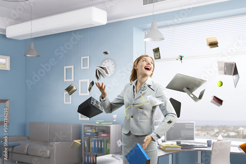 Young pretty businesswoman juggling with business items