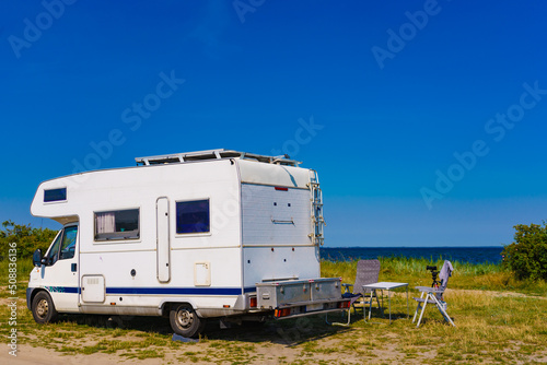 Camper camping on sea shore