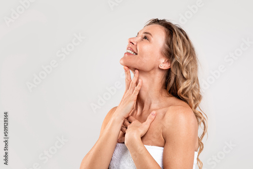 Double Chin Treatment. Beautiful Middle Aged Woman Touching Smooth Skin On Neck