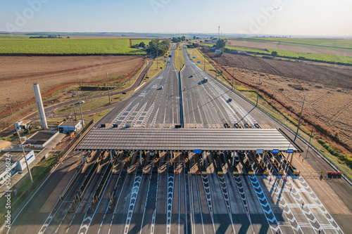 Ribeirão Preto, São Paulo / Brazil - Circa June 2022: Highway toll plaza and speed limit with aerial image, view of automatic payment lanes, non-stop.