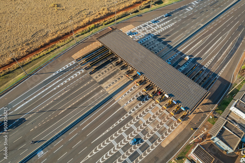 Ribeirão Preto, São Paulo / Brazil - Circa June 2022: Highway toll plaza and speed limit with aerial image, view of automatic payment lanes, non-stop.