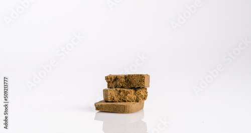 Marijuana cannabis pollen hashish on a white background.