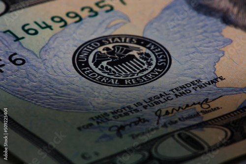 Closeup macro image of US 20 dollar bill and the Federal Reserve symbol