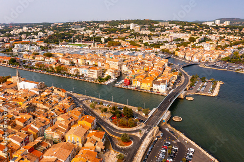 Aerial view of the administrative center with residential areas of the seaside town of Martigues, located on the Mediterranean ..coast, France