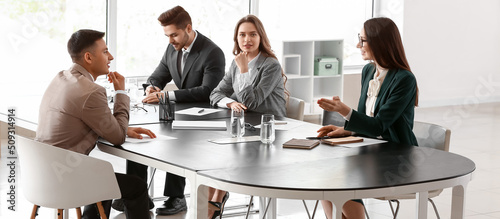 Human resources commission interviewing man in office