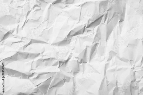 Sheet of white crumpled paper as background, closeup