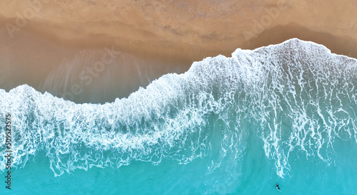 Aerial view Top view of Beach sand copy space Beautiful sea waves in Summer tropical background
