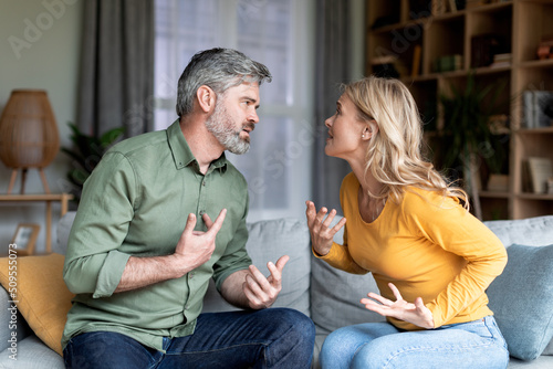 Marriage Problems. Portrait Of Middle Aged Spouses Quarreling At Home