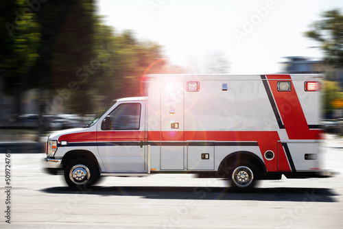 Blurred motion action view of an ambulance responding to the scene of an emergency.