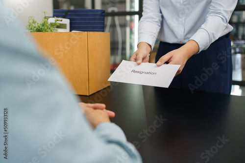 Resignation concept, Female employee sending resignation letter to boss when changes to new job