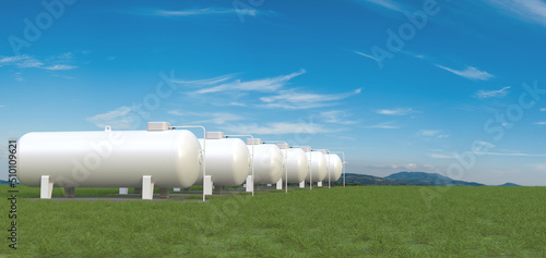 Row of big gas tanks in summer landscape