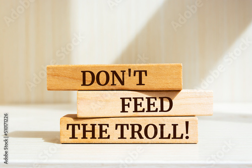 Wooden blocks with words 'Don't Feed The Troll'.