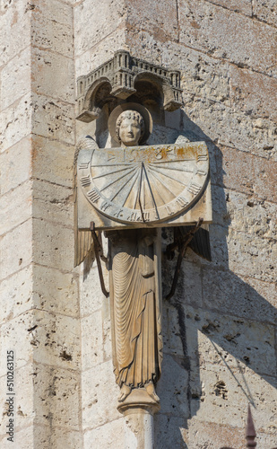 angel holding a sundial