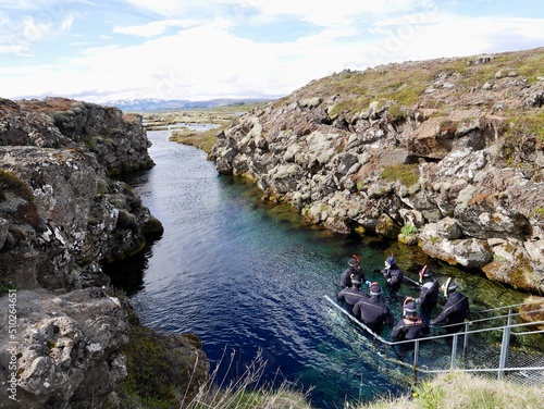 Scuba diving at Silfra rift, where Eurasian and American tectonic plate are divided in Thingvellir National Park, Iceland.