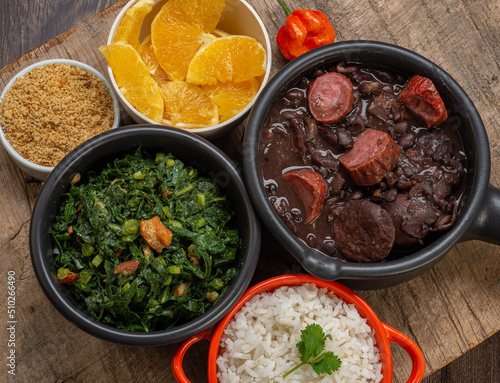 FEIJOADA: typical and traditional food of Brazilian cuisine, served with rice, farofa, orange, pepper and cabbage