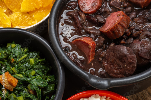 FEIJOADA: typical and traditional food of Brazilian cuisine, served with rice, farofa, orange, pepper and cabbage