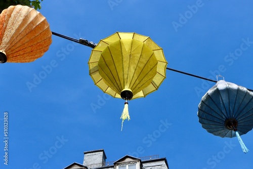 Chinese traditional lampions hanging between old houses in Luxembourg
