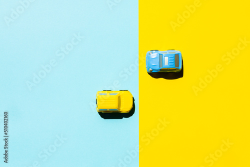 blue cars on a yellow background. place for your text